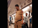 Watch: A policeman on the Delhi Metro so drunk he can't stand straight 