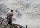 Heavy rain and typhoon deepen flood misery in Philippines  
