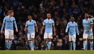 Manchester City ease past Huddersfield to cut Liverpool's lead in Premier League