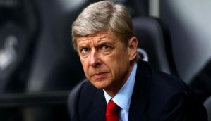 Optimistic Arsene Wenger insists Arsenal still remain Premier League title contenders 