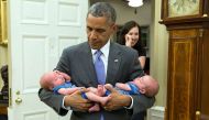 Babysitter Barack - these photos of the POTUS will melt your heart 