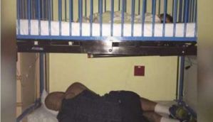 The internet loves this tired dad who slept under his sick child's hospital bed after work 