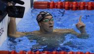 Michael Phelps gets 20th and 21st Olympic gold medals; wins 200m butterfly and 4x200m freestyle relay 