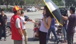 Chinese TV journalist reporting on Typhoon Meranti suspended for accessorising  