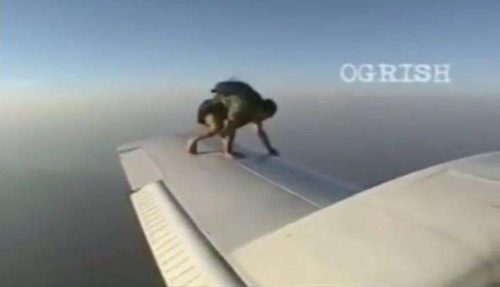 skydiver jumps off from plane.jpg