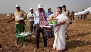 Mamata hands over land to Singur farmers, sows the first seeds 