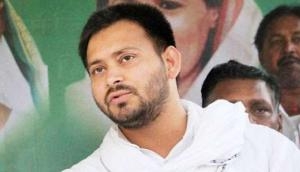 Video: Ex deputy CM Tejaswi Yadav weighted with coins in a public meet; mob looted all the coins