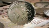 Rupee tumbles 24 paise, stronger equities restrict fall