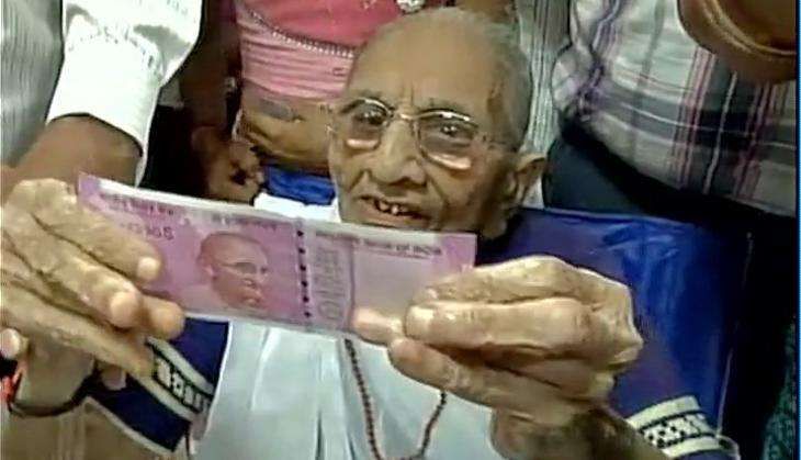 PM Narendra Modi's mother visits Gujarat bank