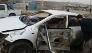Vehicle damaged in a suicide attack on foreign troops convoy in Kandahar