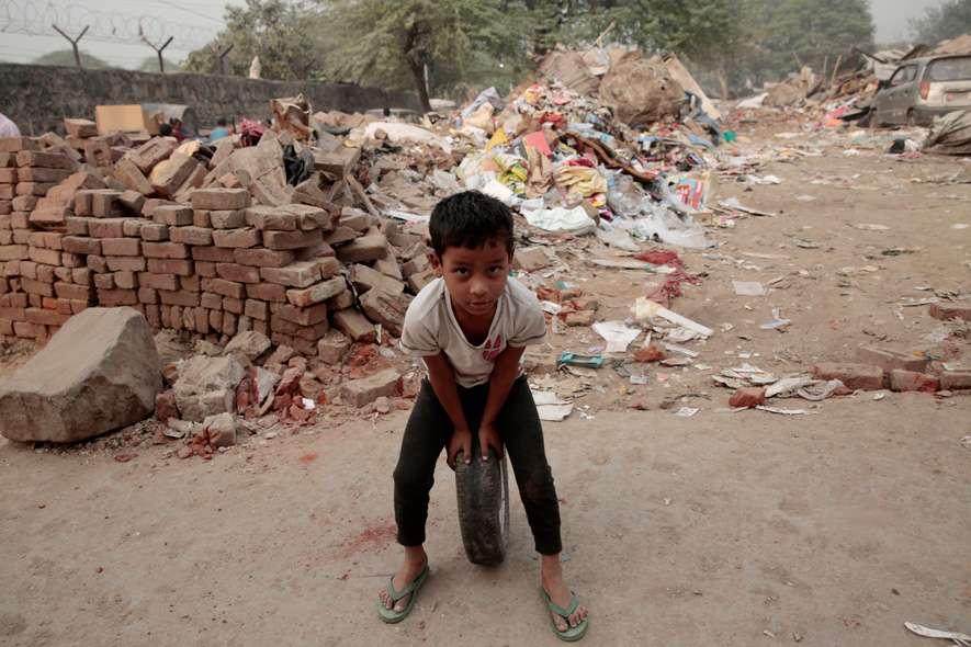 A child plays near a demolished home. The MCD demolished a slum in Mehrauli, New Delhi that left almost 1500 people homeless.