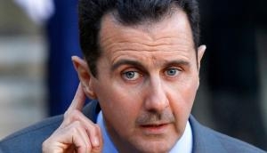 US says Assad may be preparing chemical attack, warns heavy price