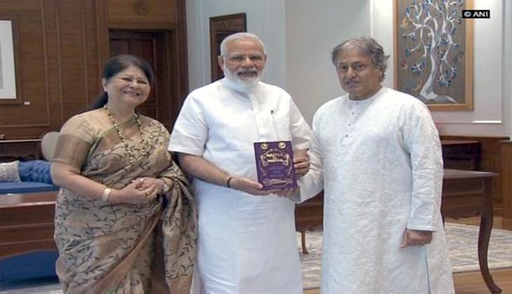 Ustad Amjad Ali Khan meets PM Modi, presents his book
