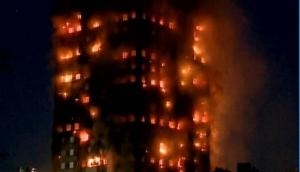 London fire: Man catches baby dropped from 10th floor of tower