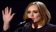 Emotional Adele visits London fire site, comforts victims