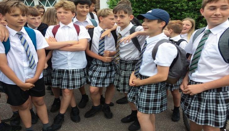 Teenage boys arrive at school in skirts to protest against 'no shorts' policy