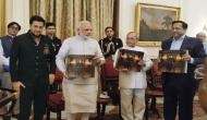 PM Modi released coffee table book, presented first copy to President of India on President Pranab Mukherjee - A Statesman