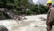 3 dead, 10 homes buried in Philippine monsoon landslide