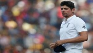 Alastair Cook 's mighty 243 helps England tighten grip against Windies in first Test