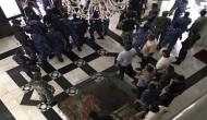 Opposition lawmakers protest as Maldivian Parliament resumes functioning under tight security