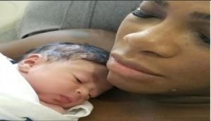 Serena Williams' bundle of joy flexes her 'biceps'!