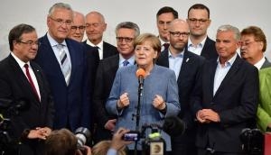 Angela Merkel wins a fourth term in office – but it won't be an easy one