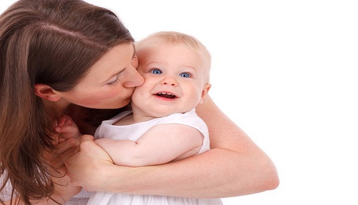 A mother's voice changes while talking to her newborns