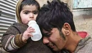 Viral pictures of 2 newly orphaned infants become latest symbols of the tragedy in Kashmir