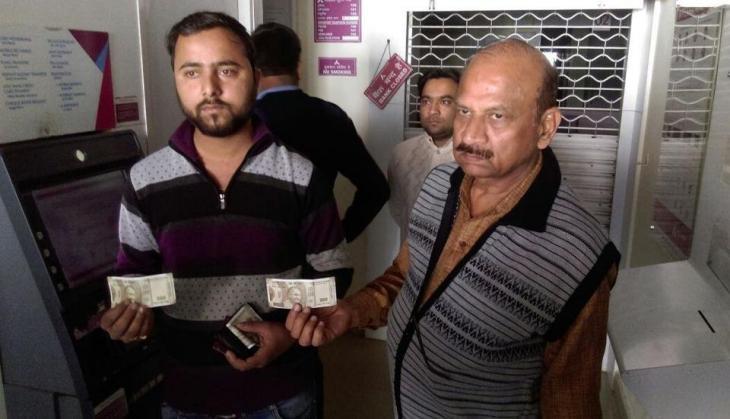 man at atm with fake currency