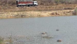 Five bodies found in Andhra lake, role of sanders smugglers suspected