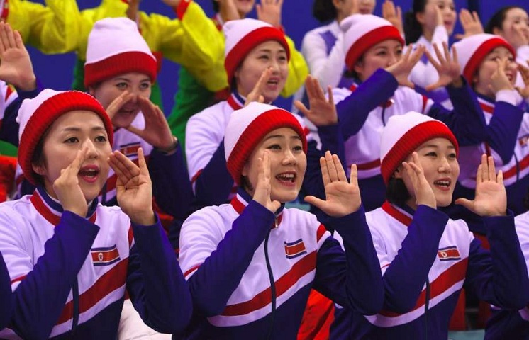 North Korean cheerleader elbowed for cheering American skaters, video goes viral 