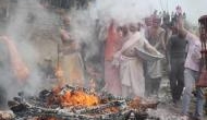   Devotees in Varanasi celebrate Holi with pyre ashes 