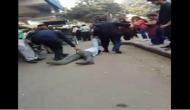 Viral video shows two traffic cops thrashing man