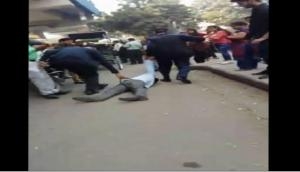 Viral video shows two traffic cops thrashing man