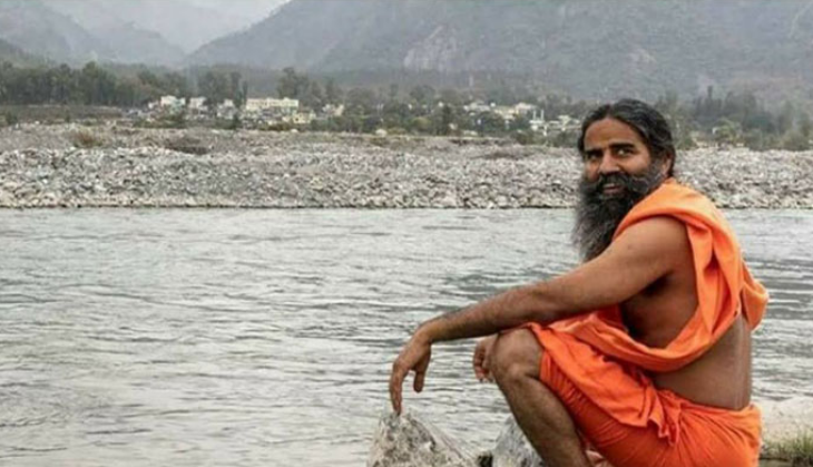 Patanjali founder Baba Ramdev got slammed for wearing 'videshi' Woodland shoes; Netizens advised him to crop the picture properly
