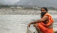 Patanjali founder Baba Ramdev got slammed for wearing 'videshi' Woodland shoes; Netizens advised him to crop the picture properly
