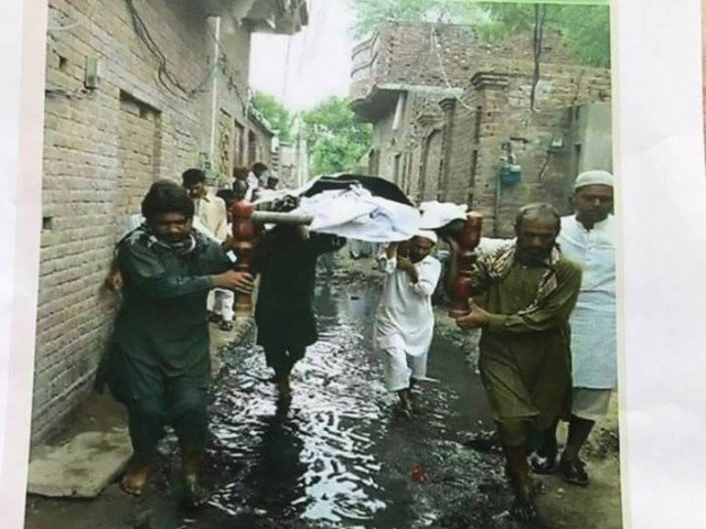  Picture of funeral procession through sewerage water calls for an investigation