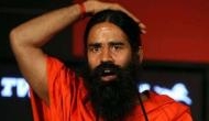 Man arrested for posting Ramdev's morphed photo in WhatsApp group
