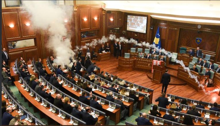 Opposition MPs in Kosovo throw tear gas in Parliament to stop voting on border agreement