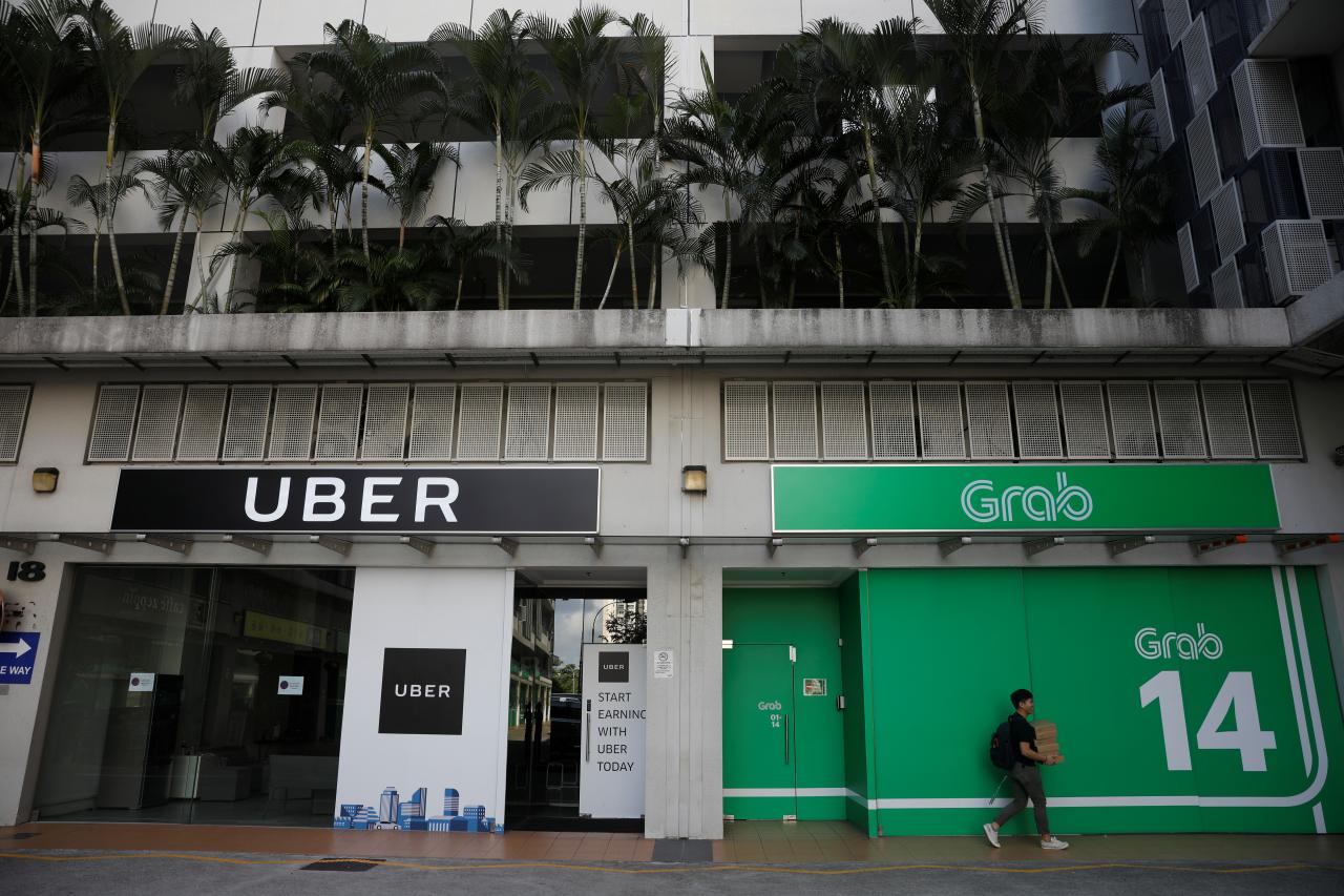 Uber to sell Southeast Asia business to Singapore-based rival Grab
