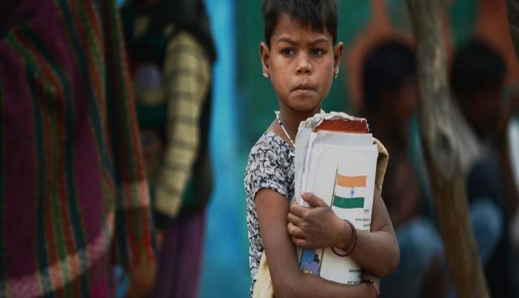 Child Holding Books