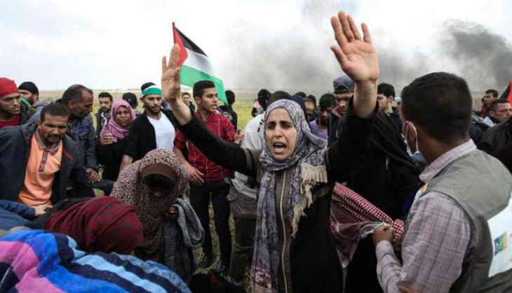 Clashes erupted as thousands of Gazans marched near the Israeli border in a major protest dubbed