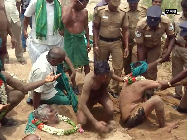 Farmers bury themselves in sand over Cauvery water dispute