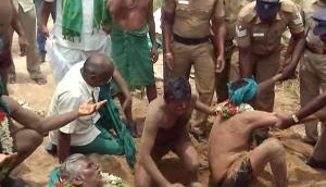 Farmers bury themselves in sand over Cauvery water dispute