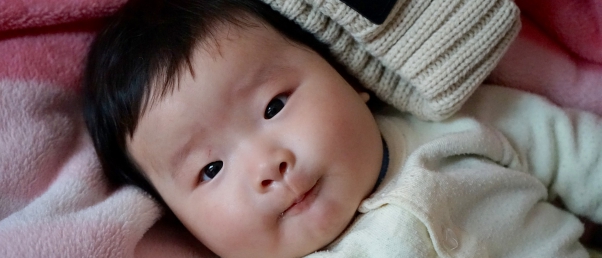 A Chinese baby born four-year after his parents died in a car accident