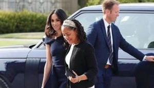 Meghan Markle wears a navy blue Roland Mouret outfit to arrive at Cliveden House; video inside 