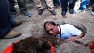 Swachh Bharat Mission: Telangana's Medak District Collector cleans a toilet pit with his bare hands to turn night soil into organic manure