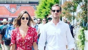  Duchess of Cambridge's sister Pippa Middleton flaunts her tiny baby bump with husband James Matthews at French Open 