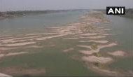 Dry patches of sand appears in stretches of river Ganga