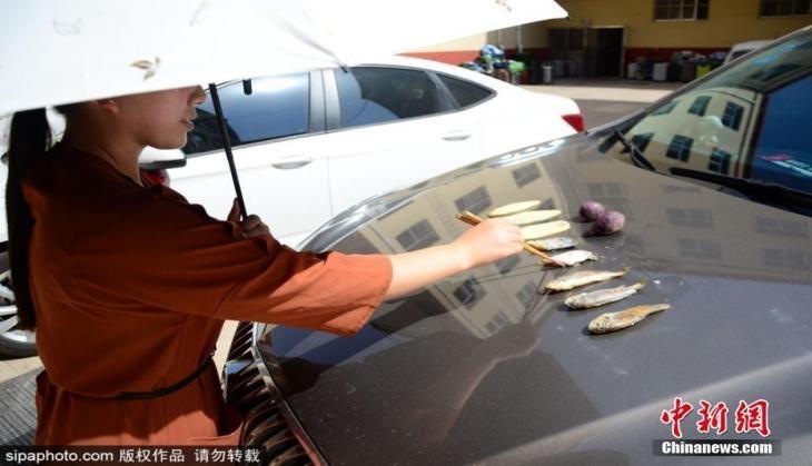Woman frying Fish
